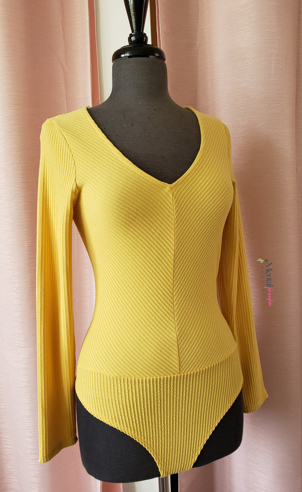 Yellow long sleeves bodysuit.